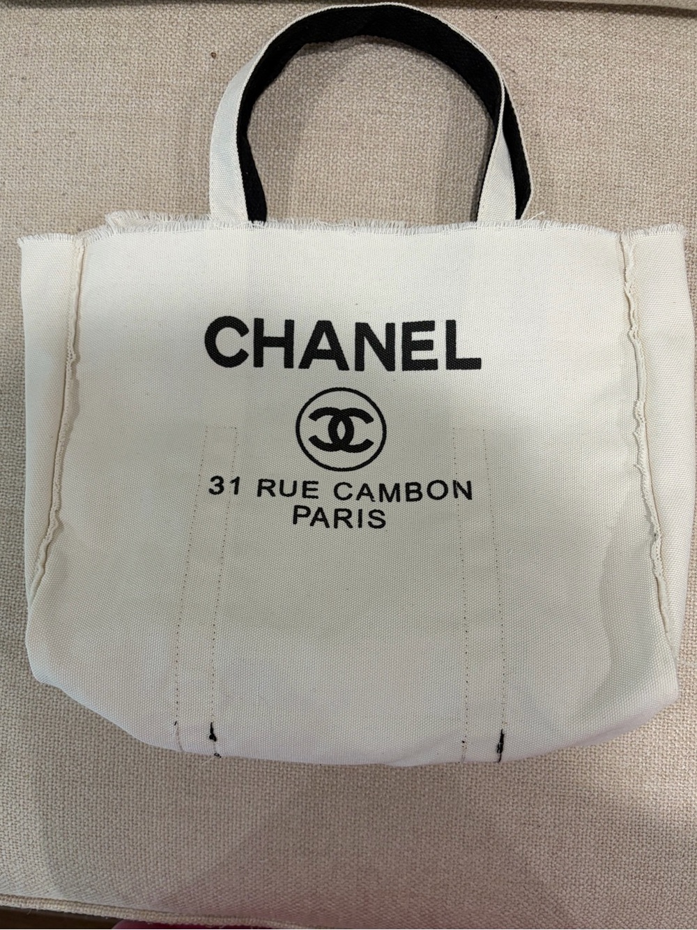 CHANEL White Canvas Tote with Black Logo and Handles